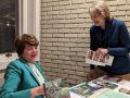 susan v. with her books and info  susan v. with her books and info