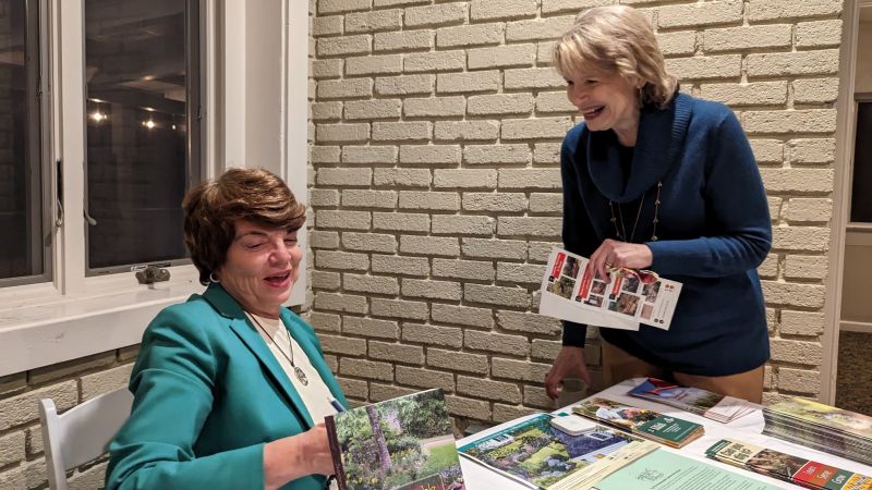 susan v. with her books and info  susan v. with her books and info